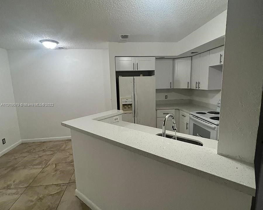 1st image of 3450 Pinewalk Dr N APT 425