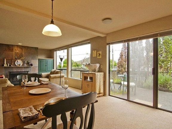 The open floor plan makes the most of the 755 sq. ft. of living space. Large picture windows and sliding glass doors to the patio bring the outdoors in and fill this ground floor unit with light.