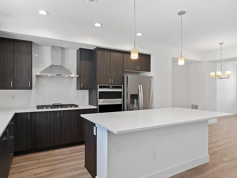Light & Bright Chef's Kitchen with Stainless Steel Appliances, Soft Close Cabinets, Oversized Center Island, Quartz Countertops, Subway Tile Backsplash, Gas Stove & Upgraded Hood