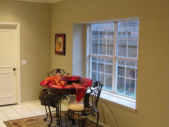 Breakfast area off kitchen with bay window.