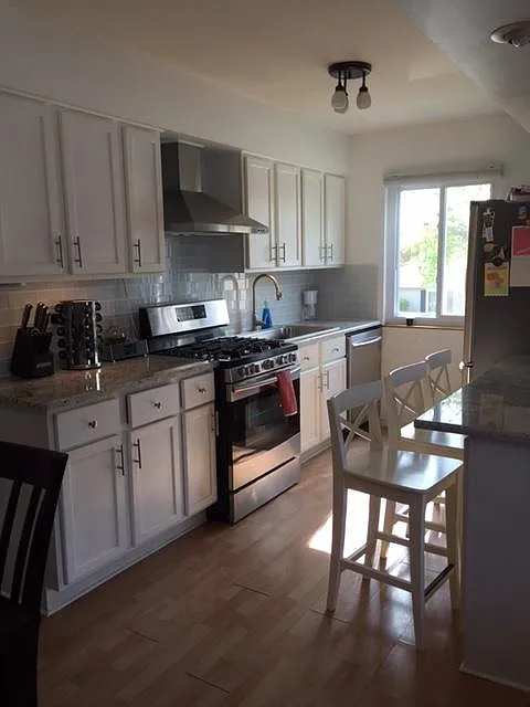 Updated kitchen with granite countertops and updated stainless steel appliances