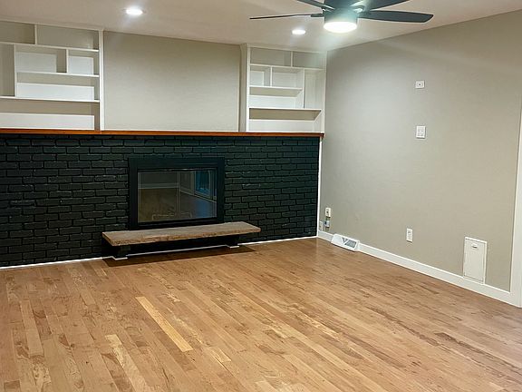 Main floor living area with wood burning fireplace