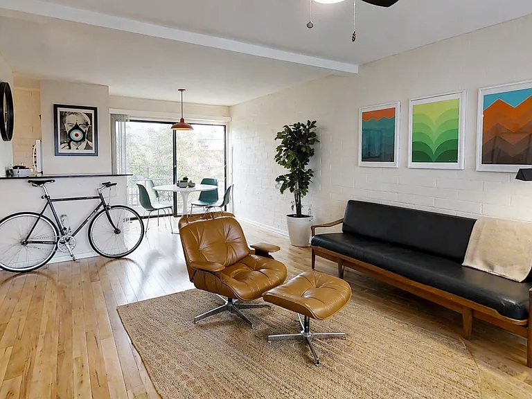 Real wood flooring and floor to ceiling windows.