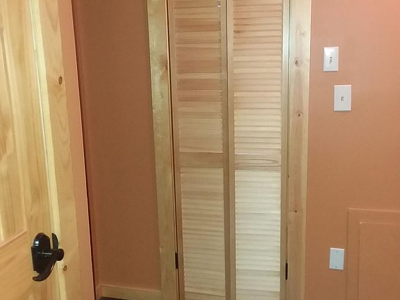 Linen closet in hall and bathroom door