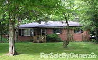 Two Floors with Full basement & carport
						:
						House surrounded by 3.7 forested acres
with two new decks and new septic system