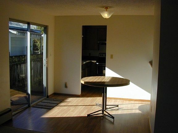 Dinning room open to living room and slider out to side yard and wood storage to keep firewood dry.