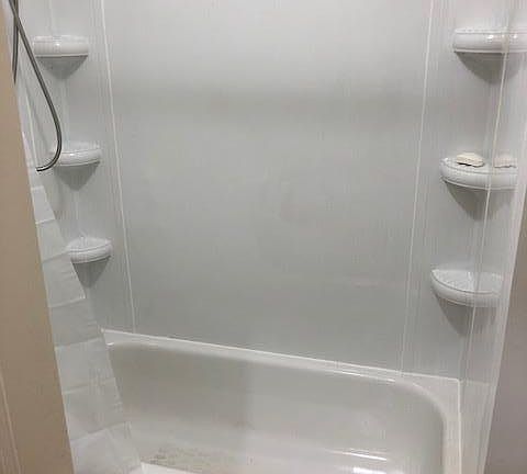 Bathroom with new tub enclosure