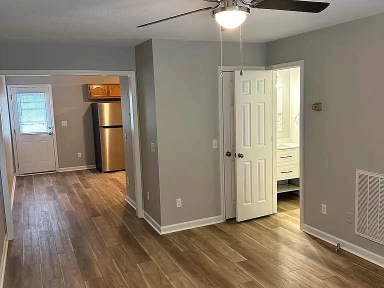 Large living room with 1/2 bath and storage closet.