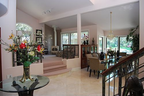 View of foyer, living and dining