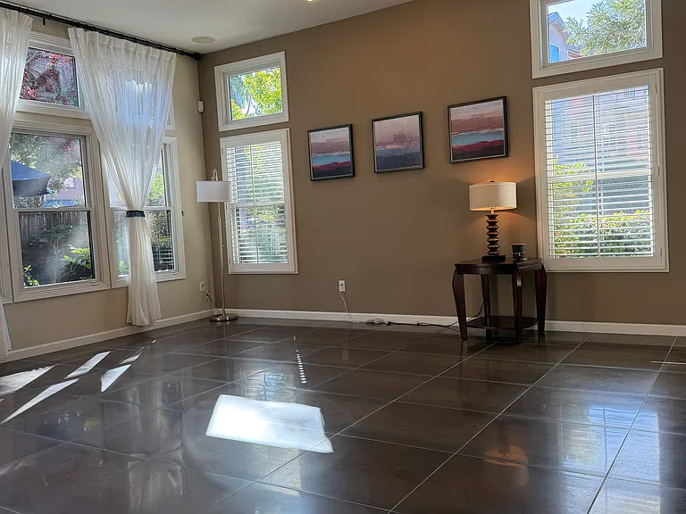 Standing near the refrigerator looking at the living room.