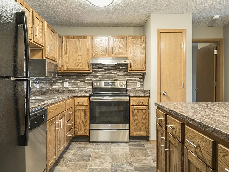 Our renovated kitchens are designed to impress with updated cabinetry, sleek countertops, stainless steel appliances, and a modern tile backsplash that brings it all together.