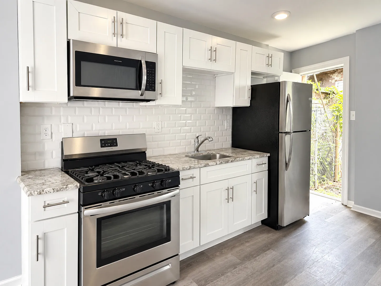 Bright 2-Bedroom Home with a Stylish Kitchen & Central Air — Photo 3