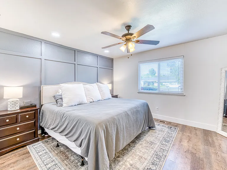 Primary bedroom features a walk in closet and en suite bathroom. Large enough to fit a King sized bed and his and hers nightstands.