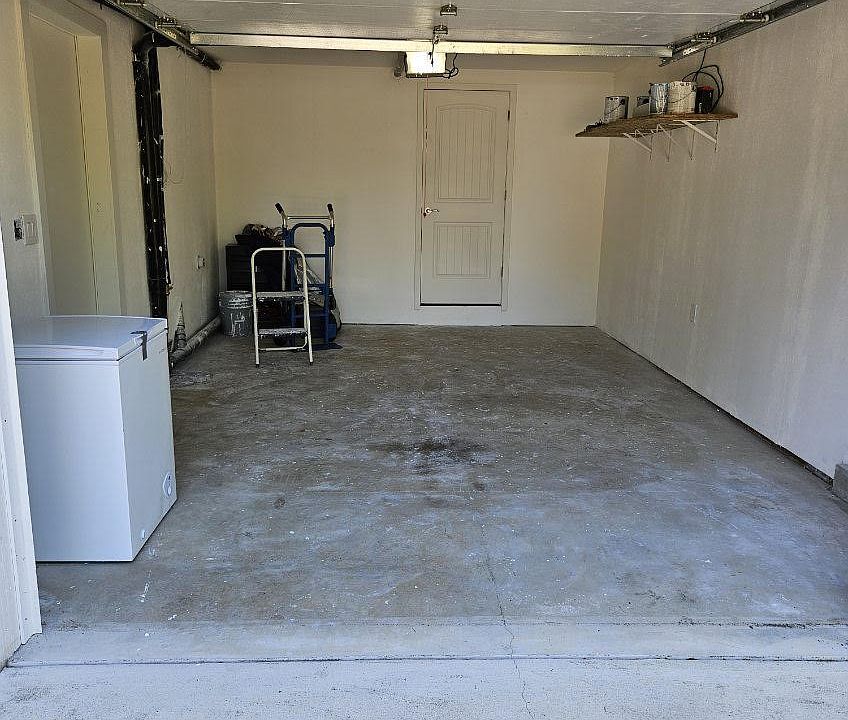 1 car Garage with door to office and bathroom.