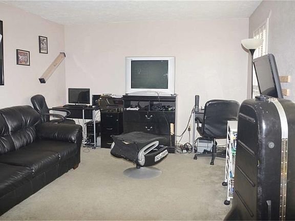 Formal living being used as game room.