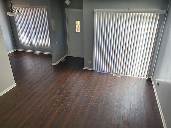 View of dining area & living area with access to composite decking patio