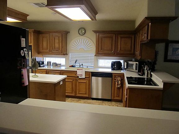   CUSTOM WINDOW ACCENTS AND FAUX WOOD BLINDS THROUGHOUT