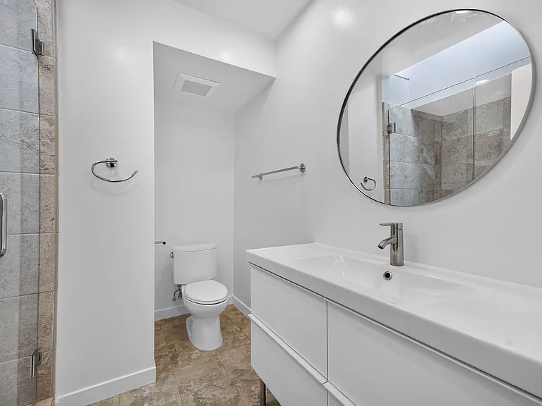 BATHROOM HAS NEW MODERN BATHROOM VANITY, FAUCET & DESIGNER MIRROR