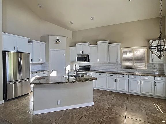 4th image of 11535 E Seaver Ave