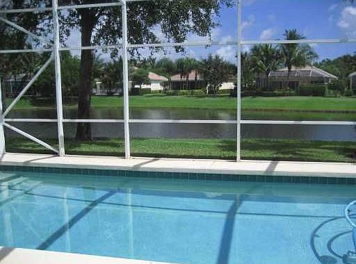 Screened Pool &amp; Patio overlooks lake on 2 sides