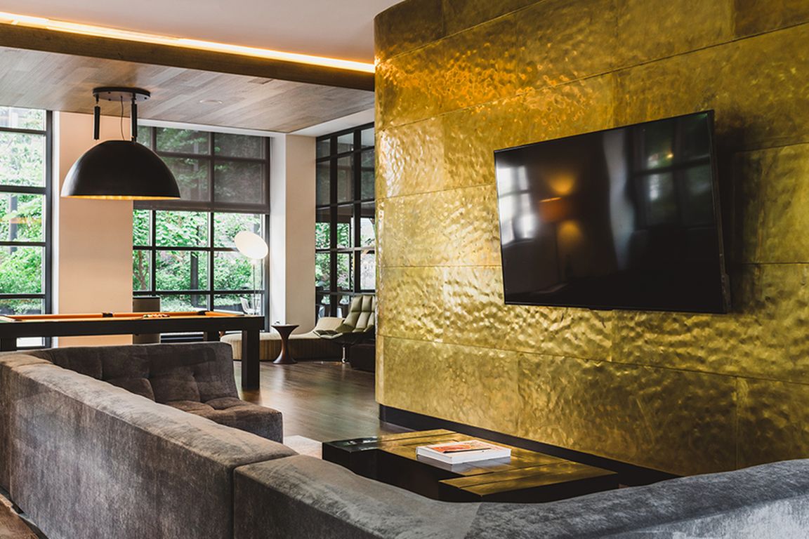 TV and game lounge with billiards table and flat screen TVs