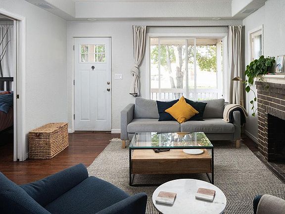 Living room with great natural light and shade from four large trees in the front yard.