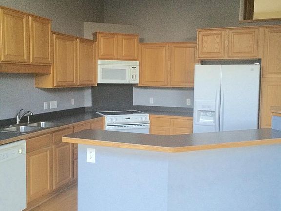 Kitchen with center island from dining area