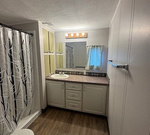 large bathroom with walk in shower.
