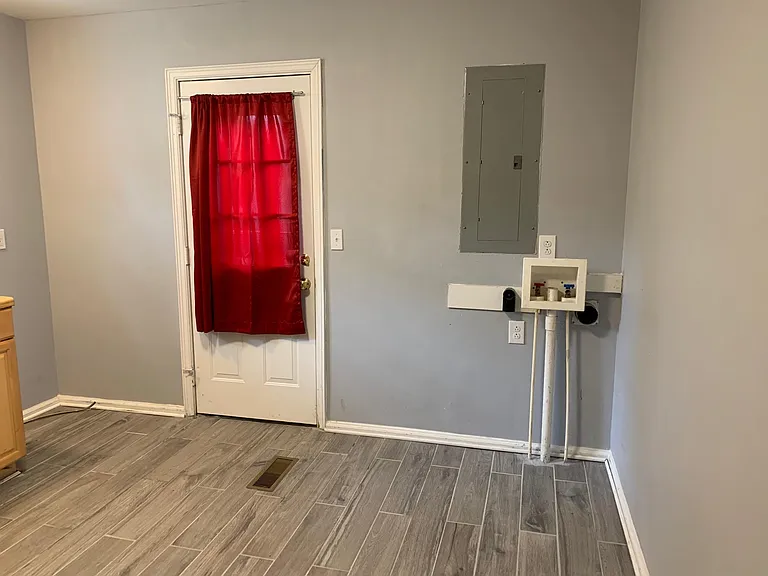 Kitchen - back door, washer / dryer connections. Refrigerator not in this photo.