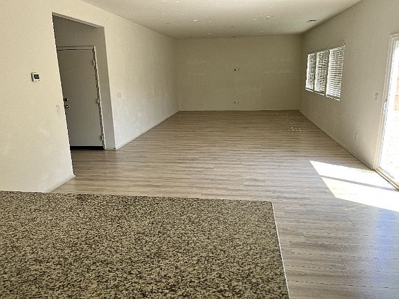 Large open family and dining area. Sliding doors lead to large backyard
