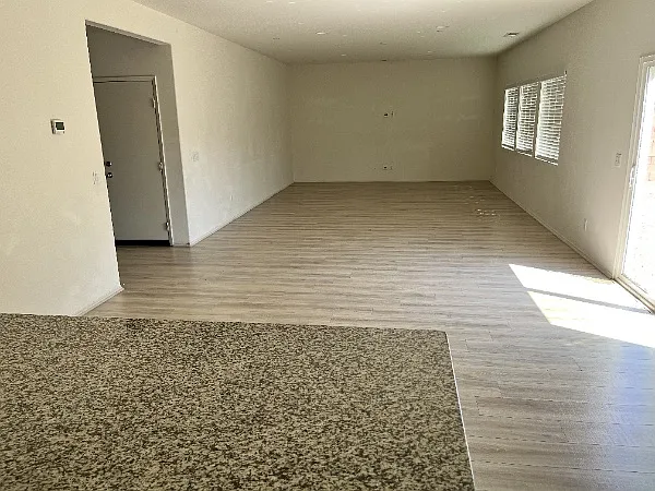 Large open family and dining area. Sliding doors lead to large backyard