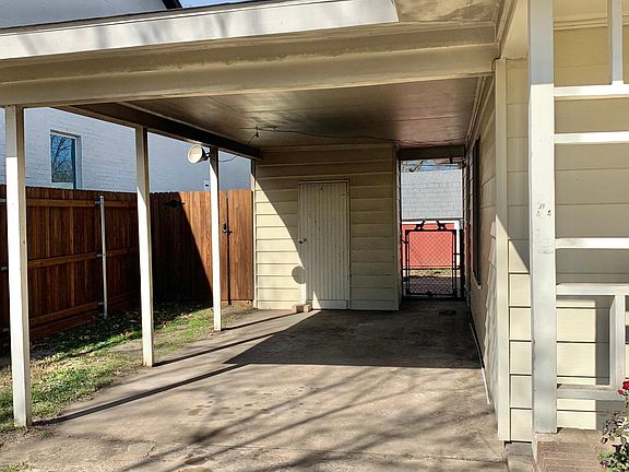 Storage area behind carport as well as back door