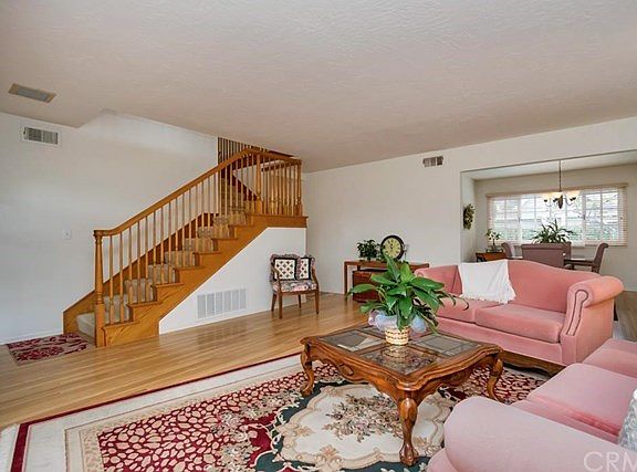 Wood floors & staircase bring lots of charm.