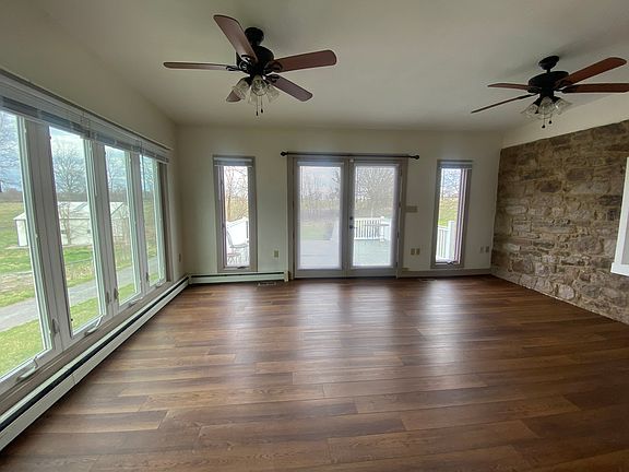 Family room with views of the farm and mountains beyond.