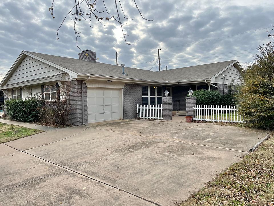 Out door parking/front entry and garage which is side entry 4 car drivie-way
