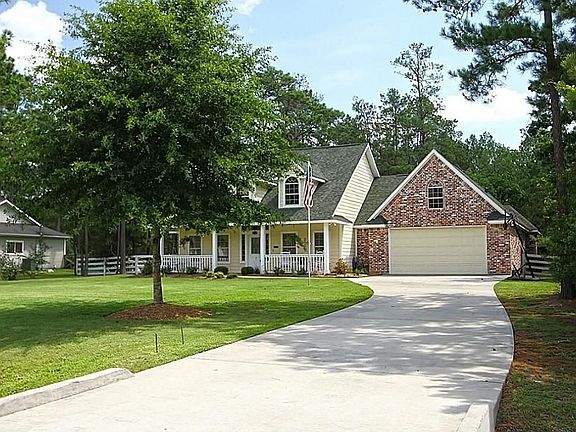 Beauty  of the trees & professional landscape with this driveway leads to this home that is ready & waiting for your family.