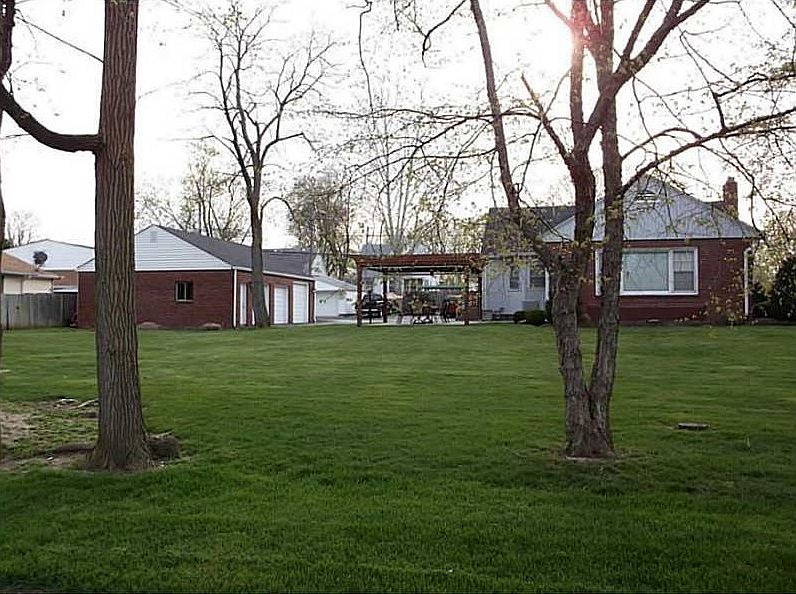 Exterior Front. NICE BRICK RANCH WITH OVERSIZED 3 CAR DET GAR., ON 3 LOTS TOTALING APPROX 1/4 AC