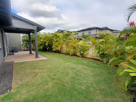 Mature landscaped yard with sprinkler system.. Easy to maintain.