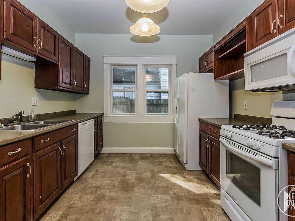 Kitchen includes self-cleaning gas range, microwave, dishwas