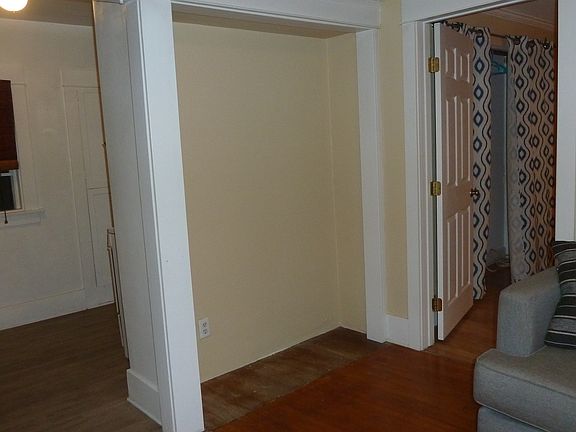 Looking into the kitchen and closet from the living room.