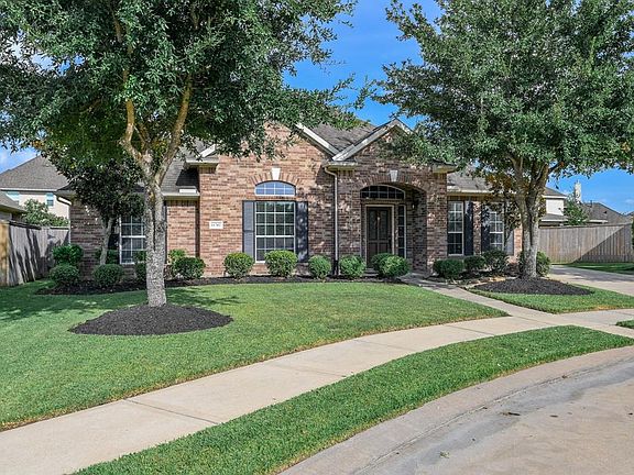This home offers great curb appeal complete with a lush lawn and landscaping.