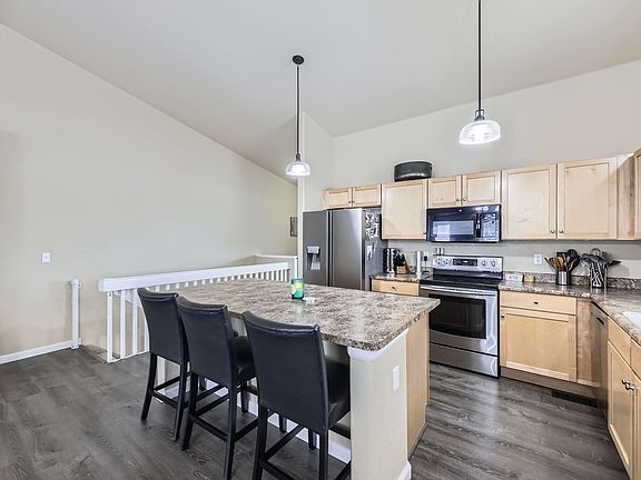 Stairs to lower level are off the kitchen - two bedrooms, a bathroom, and another living space in basement