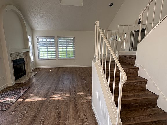 fireplace and stairs leading upstairs