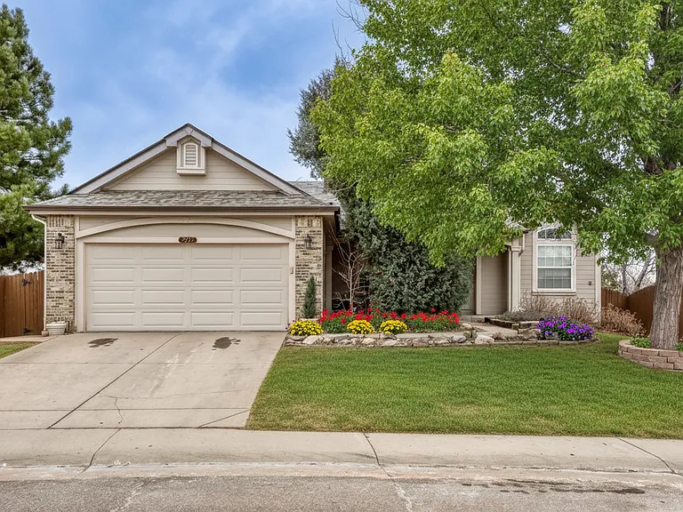 Front of house. Entrance is gate on the left of the garage.