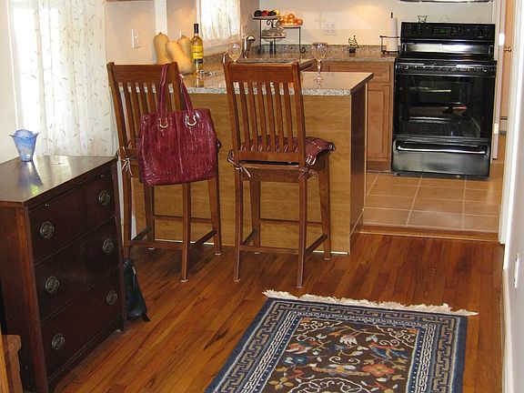 Open kitchen-dining area, toward the private, just one step to get in entry.