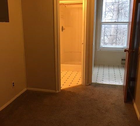 Dining space with bathroom and kitchen entrance