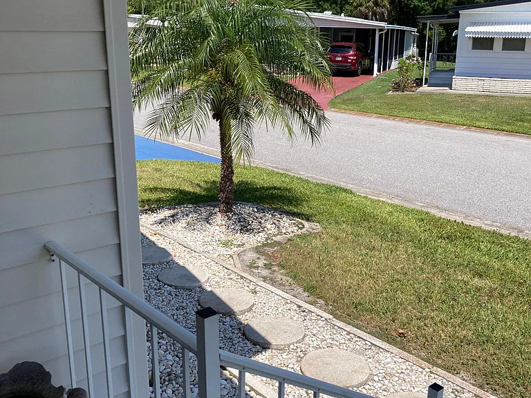 Photo off the front porch you can't tell but the neighbors across both ways have their shades pulled down and can't (don't want to ) look into your house. I find that a plus.
