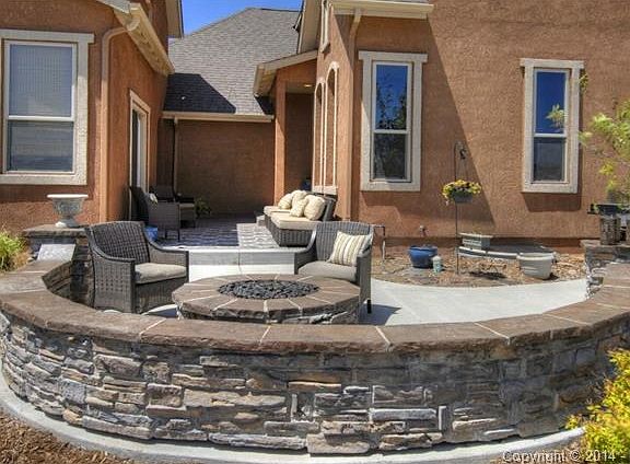 From the courtyard it's a step away to the stone fire pit on the