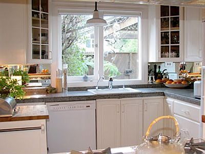 Kitchen overlooks entry patio.