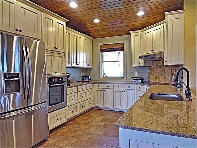 Kitchen with custom cabinets and stainless appliances.
